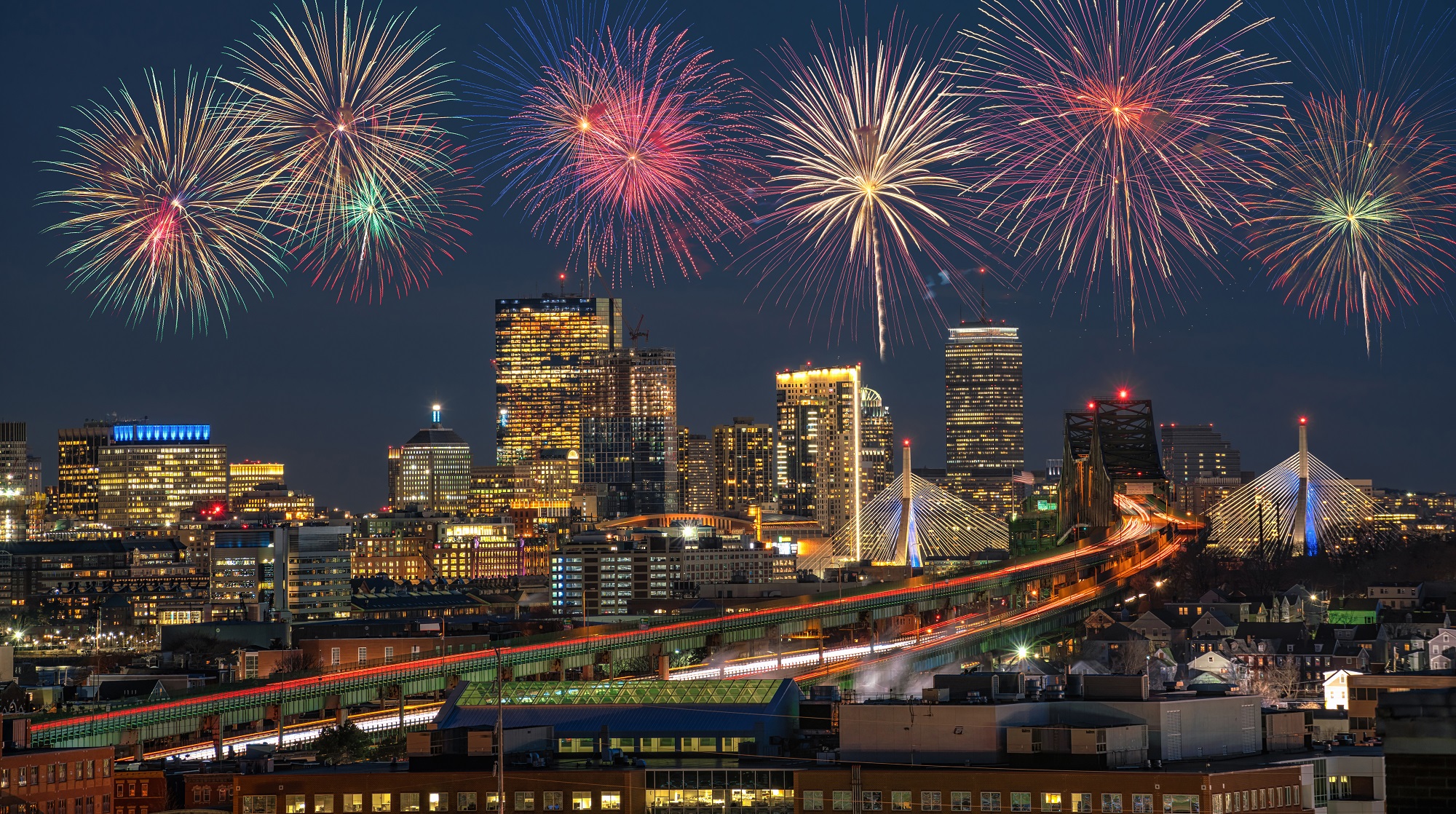 Fourth of July fireworks over city. 